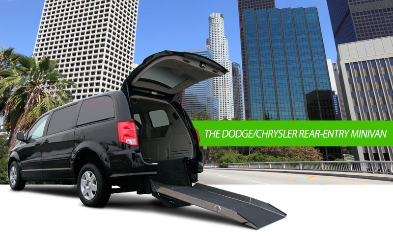 dodge-chrysler-lg Black rear entry Dodge Chrysler minivan in front of cityscape
