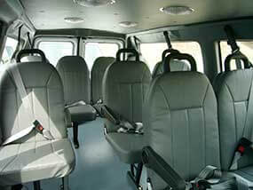 Interior of minibus shuttle showing seats