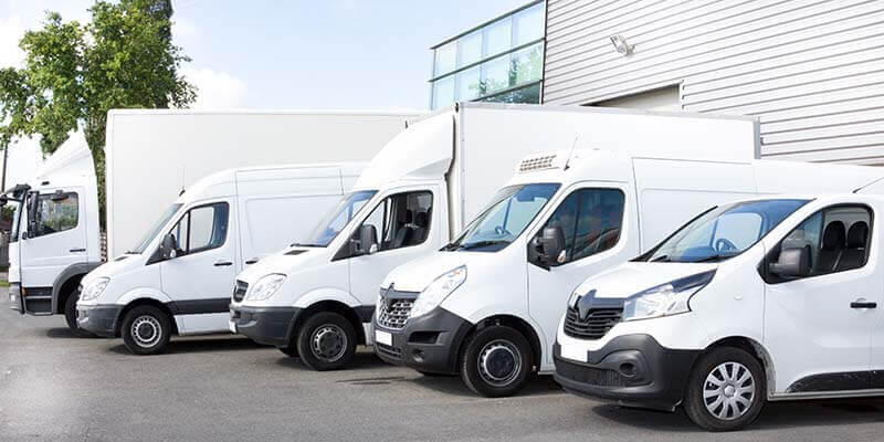 Commercial vehicles sitting in lot for inspection